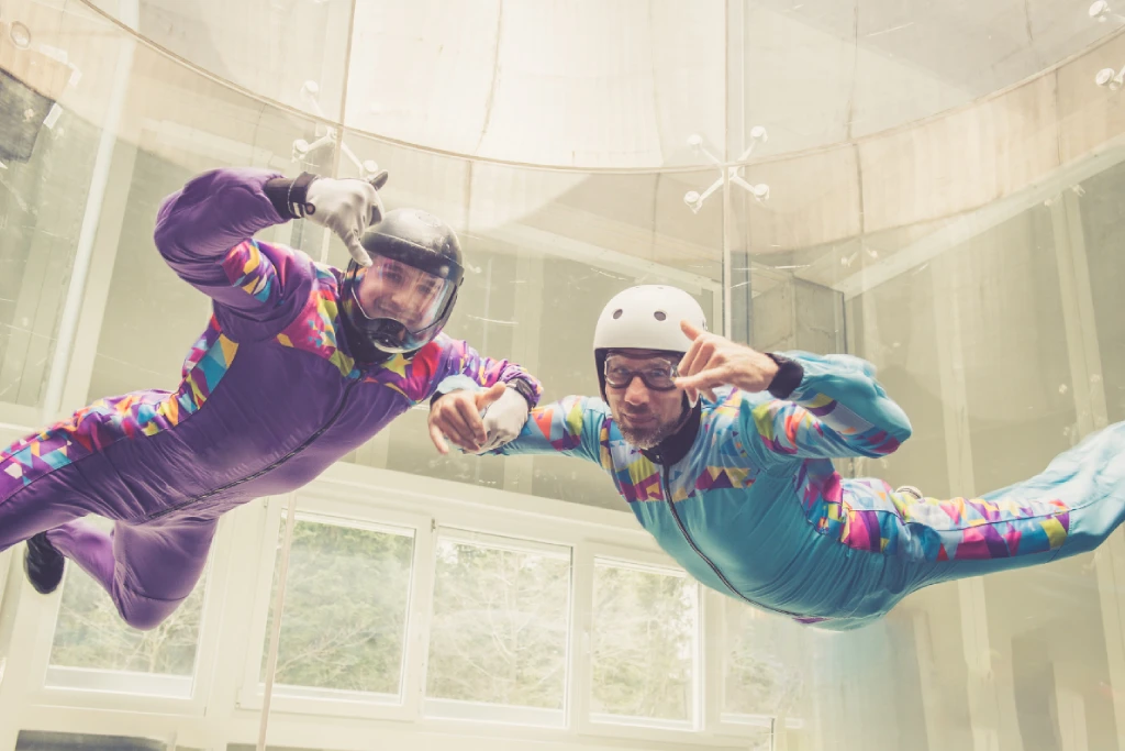 Two men indoor skydiving